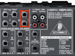 Aux Sends highlighted on a Behringer Xenyx X1204 mixer